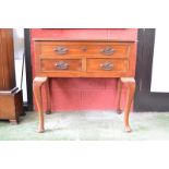A George III mahogany lowboy, canted rectangular top above one long and two short drawers,
