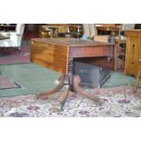 A Regency mahogany Pembroke table, drawer to frieze, ring turned column, sabre legs,