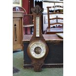 A carved oak aneroid banjo barometer, Martin Wilkinson, Mansfield.