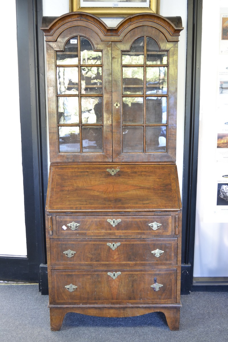 A George I style walnut double-dome bureau bookcase,