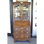 A George I style walnut double-dome bureau bookcase,