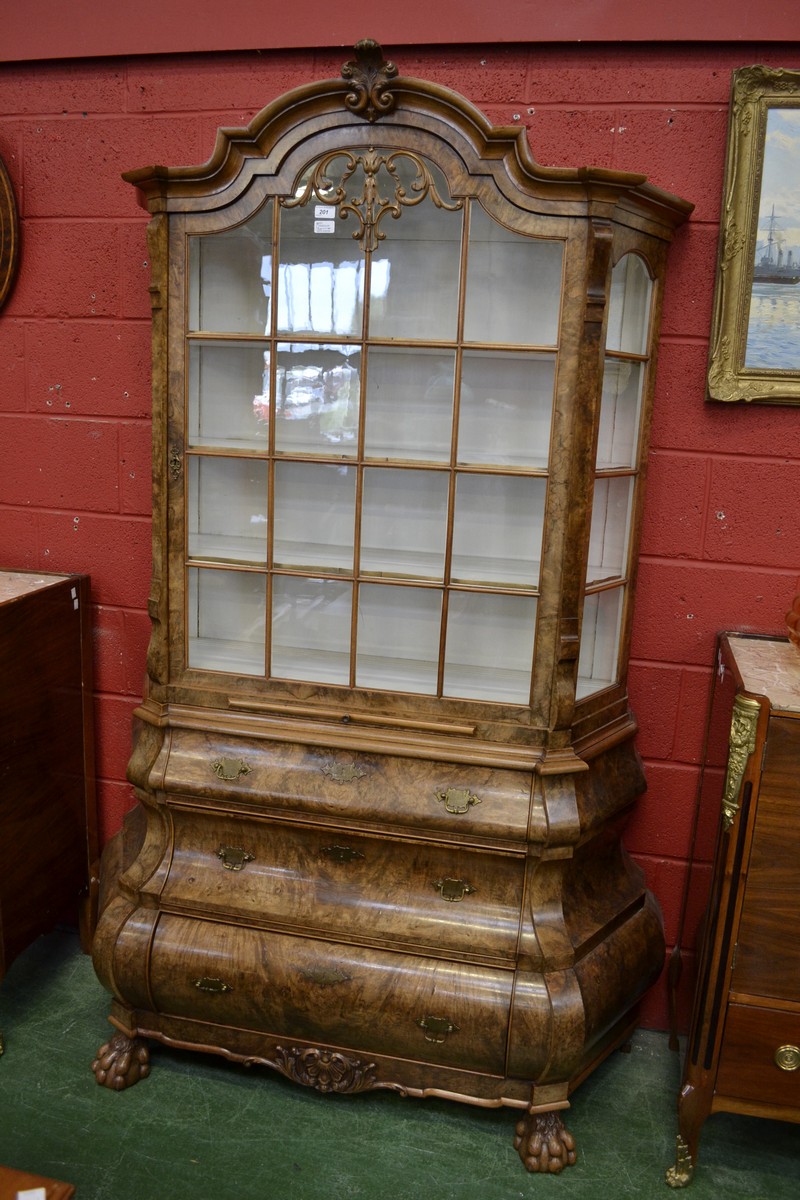 An 18th century-style Dutch walnut bombe shaped display cabinet,