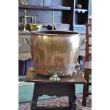 A substantial 19th century twin handled copper lock bucket, brass paw feet, 38cm high.