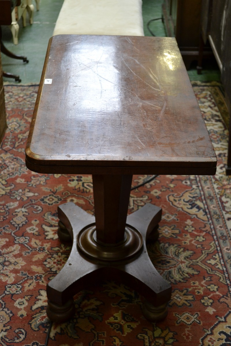 A George IV mahogany pedestal card table, folding top enclosing a inset baize lined playing surface,