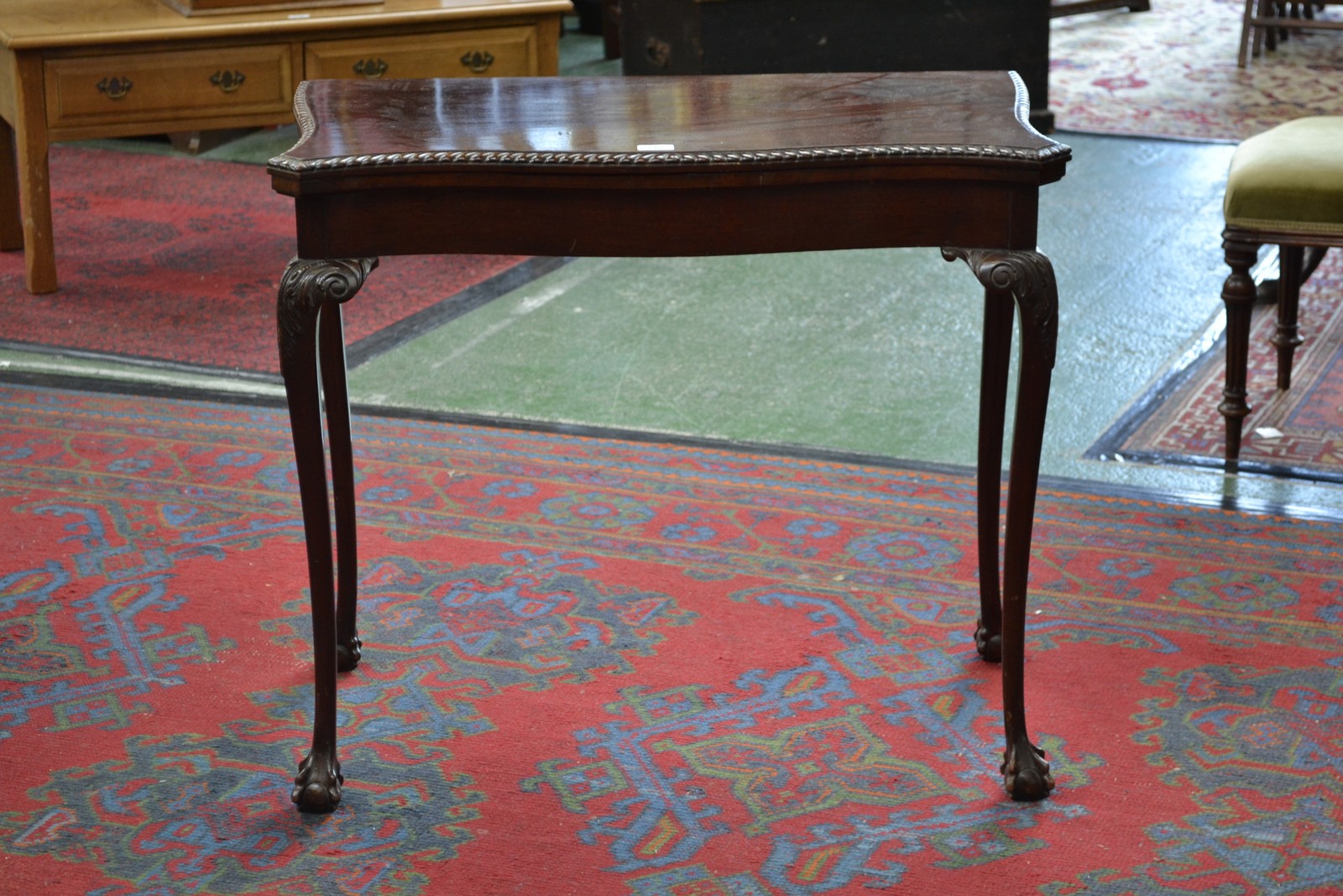 A George III Revival mahogany serpentine card table,