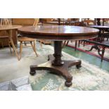 A George IV mahogany centre table, circular tilting top, panelled column with lotus socle,