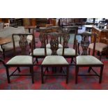 A set of six Chippendale revival dining chairs including two carvers, shaped top rail,