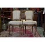 A pair of Louis XVI style giltwood side chairs, carved cresting rails, stop fluted uprights,