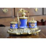 A 19th century French ormolu and porcelain Standish,