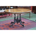 A Victorian burr walnut oval centre table, moulded tilting top,