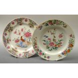 A Chinese shaped circular plate, painted in the Famille Rose palette with flowerheads and foliage,