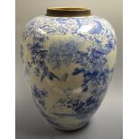 A Chinese blue and white ovoid vase, in underglaze blue with wild flowers, 31.