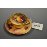 A Royal Worcester cabinet cup and saucer, painted by Hale, signed, with ripe apples,