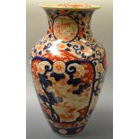 A Japanese Imari vase, painted with floral roundels and scrolls, 37cm high,