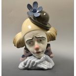 A Ladro bust of a pensive clown.