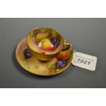 A Royal Worcester cabinet cup and saucer, painted by Ricketts and Everett, signed,