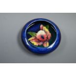 A Moorcroft orchid pattern pin dish