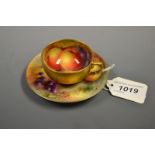 A Royal Worcester cabinet cup and saucer, painted by G H Cole and W Bee, signed, with ripe apples,