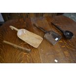 A 19th century French elm thatcher's tool; a 19th century lead mallet; a 19th century ladle;