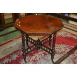 A mahogany octagonal occasional table, turned supports, turned under finial,