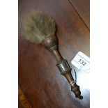 An early 20th century silver coloured metal mounted oak saddle brush,