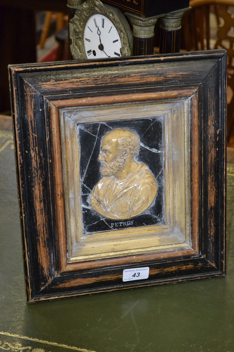 A Grand Tour style painted wood and composition portrait plaque,