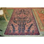 A Hamadan carpet 2.44m x 1.