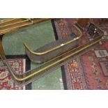 A pierced brass and copper fender; another,