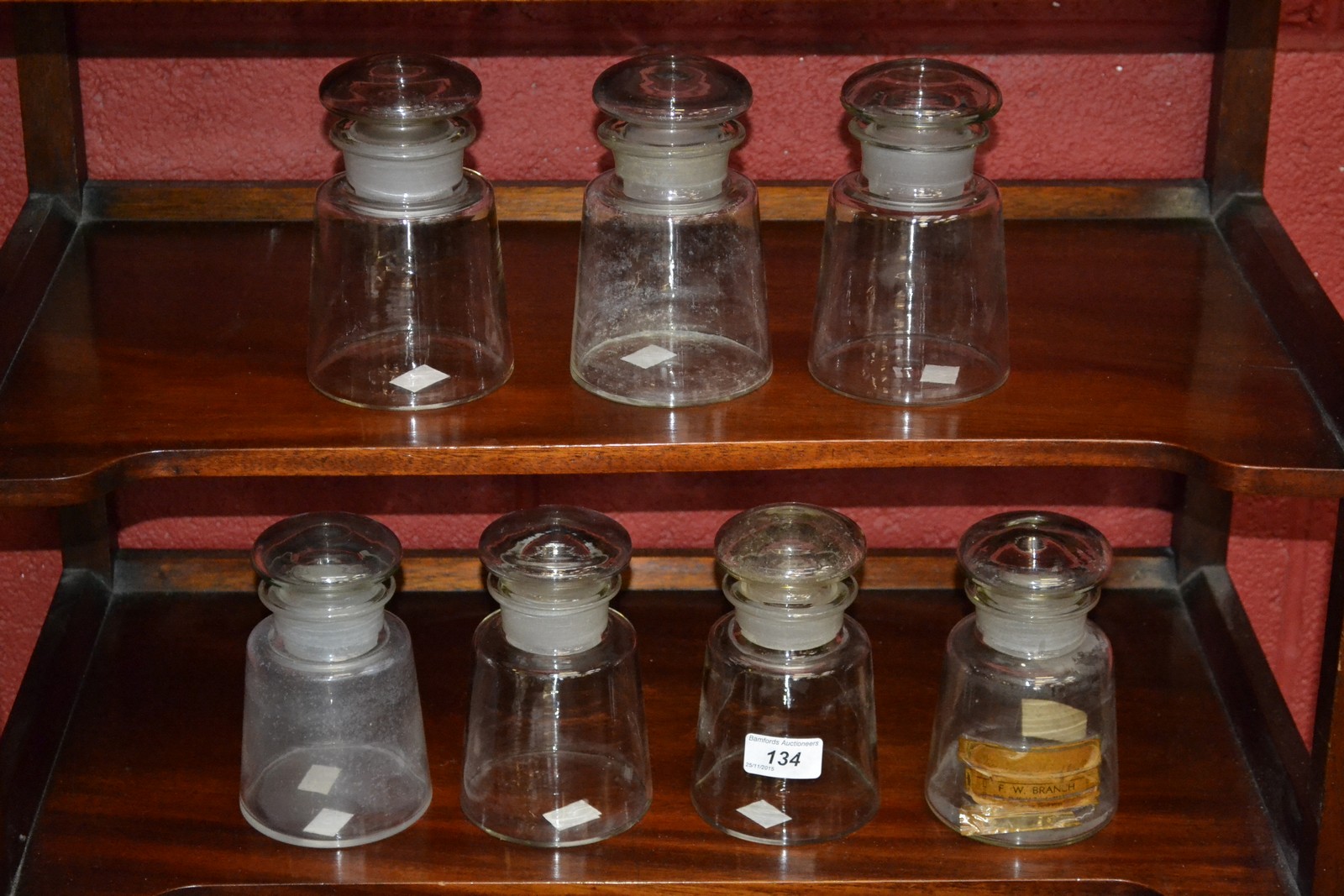 Medical - Pharmacy - a set of seven spreading cylindrical chemist's apothecary jars, domed stoppers,