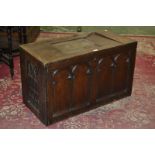 An early 20th century Welsh oak blanket chest, the top with carved panel,