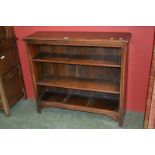 An oak floor standing open bookcase with adjustable shelving.