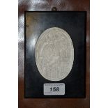 An oval plaster intaglio, depicting a soldier triumphantly crossing a boundary,