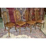 A set of four reproduction Windsor back chairs.