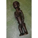 Tribal Art - a large African figure, possibly Bembe, she stands, carrying an infant on her back,