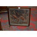 An Art Nouveau mahogany and tooled leather fire screen,