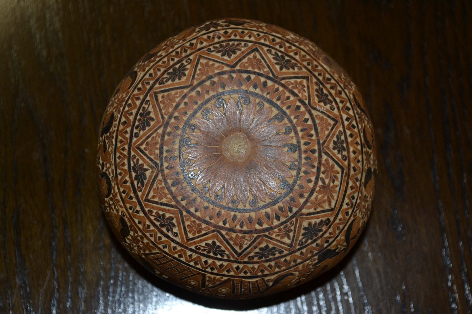 A Bolivian folk art carved nut, the surface extensively worked illustrating scenes of daily life, c. - Image 2 of 2