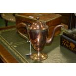 A George III copper urnular pedestal coffee pot, domed cover with urn finial, scroll handle,