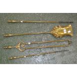 A set of three Victorian brass fire irons;