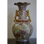 A large decorative twin handled baluster vase.