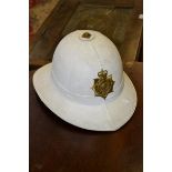 Militaria - a Royal Marines White dress helmet, with regimental badge,