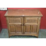 A Priory style side cabinet, hinged top,