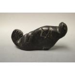 An Inuit stone carving, of a seal, stylised features,