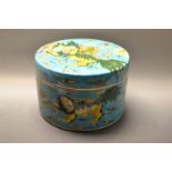 A Chinese porcelain circular box and cover, decorated with Dogs of Fo, blue ground,