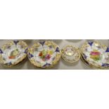 A set of three 19th century hand painted plates decorated with flowers within cobalt blue reserves