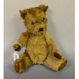 An English mohair bear, glass eyes, velvet pads,