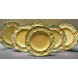 A set of six Minton Majolica fish plates, cast with shell and fish border,