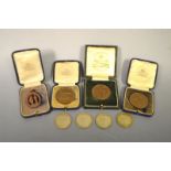 Four bronze rifle medals, a quantity of George V coins.
