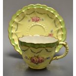 A Victorian Royal Crown Derby cup and saucer, pattern 5226, painted with pink flowers,