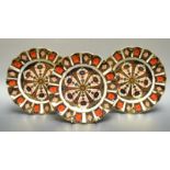 A set of three Royal Crown Derby Imari 1128 pattern shaped circular plates, 22cm diam,
