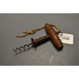 A 19th century direct pull corkscrew, turned wooden handle,